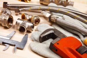Set of plumbing and tools on the table.