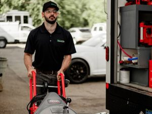 plumber carrying cable